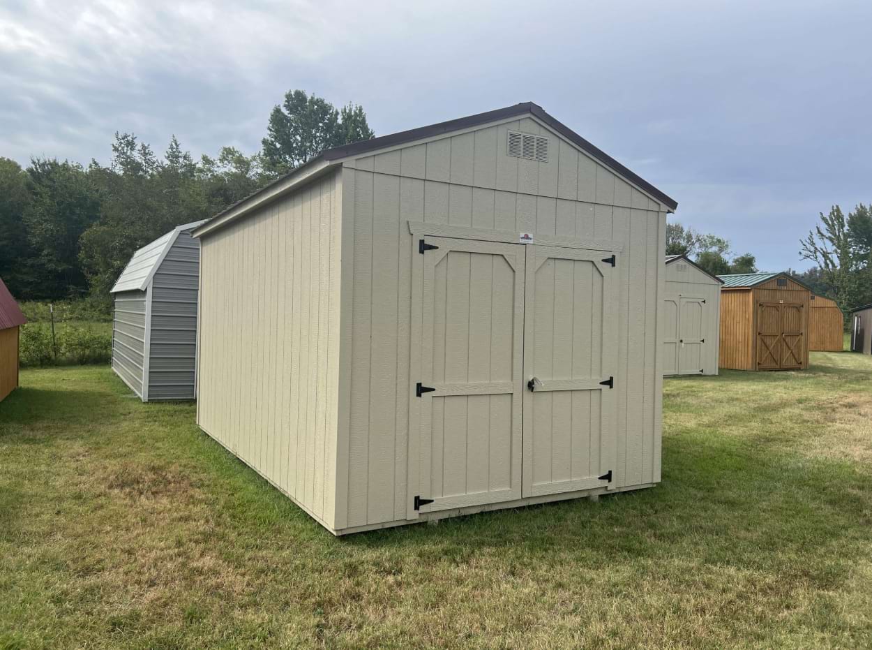 ten by sixteen utility shed with beige siding and a brown metal roof