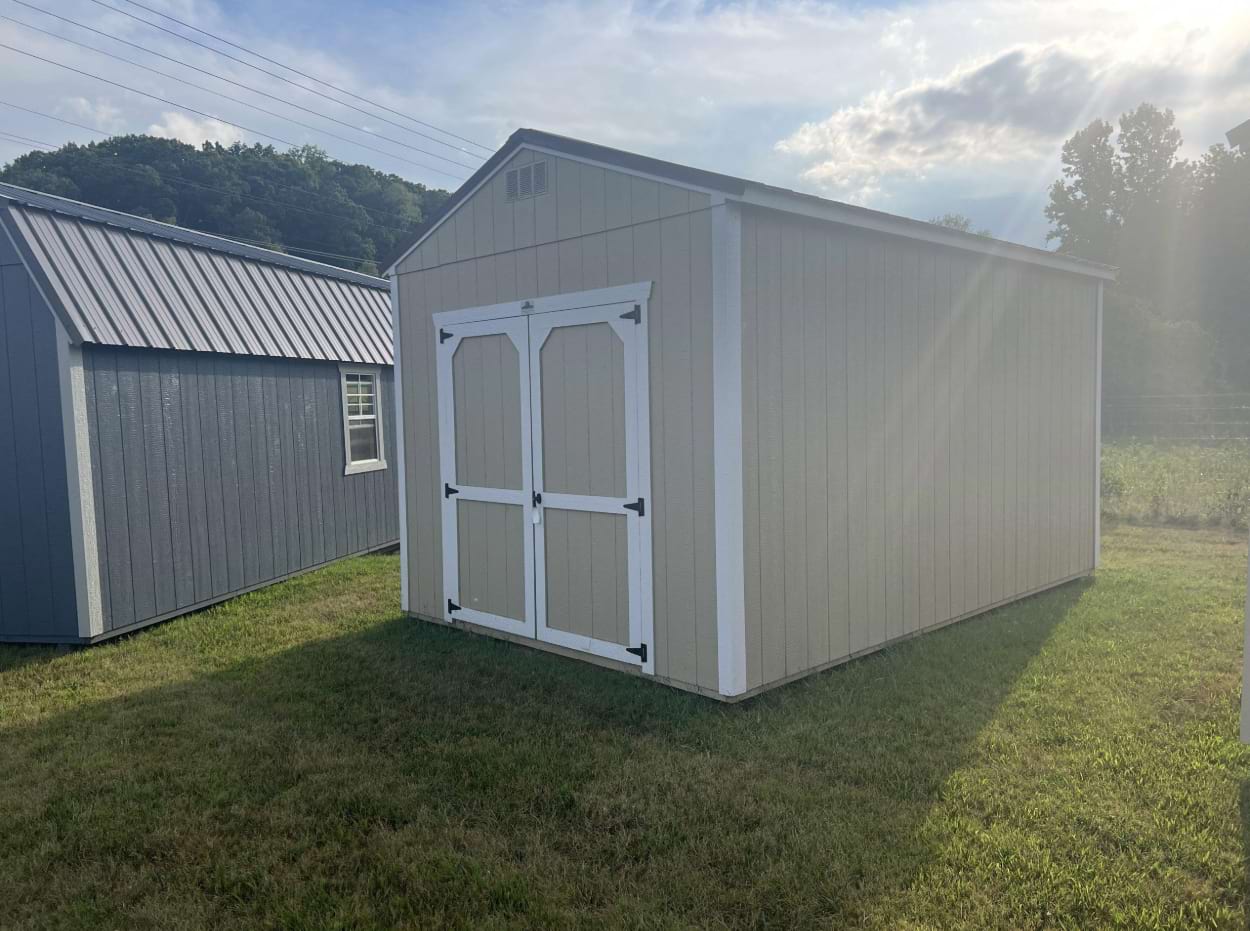 ten by sixteen utility shed with beige siding and white trim