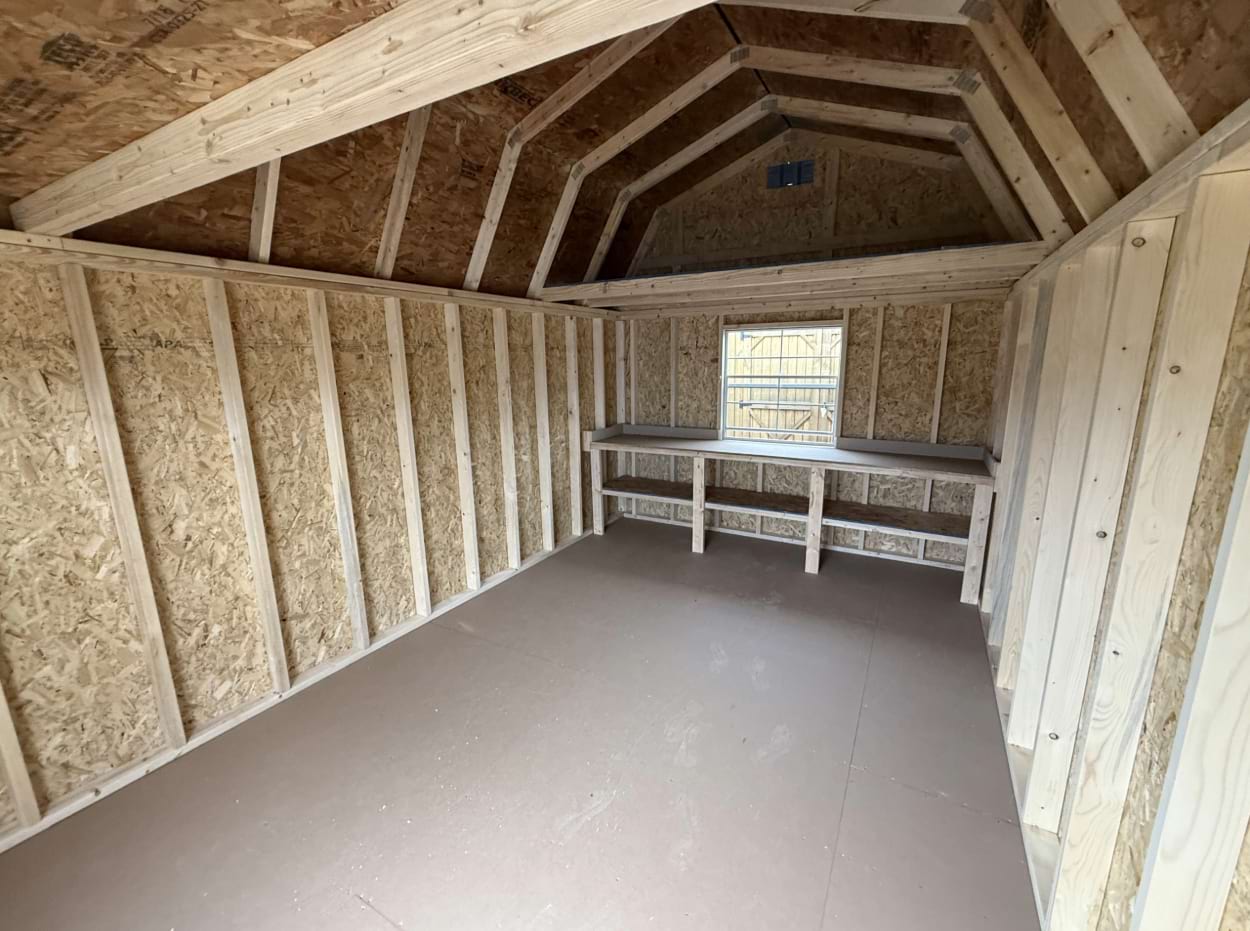 ten by sixteen lofted barn interior with window and shelf